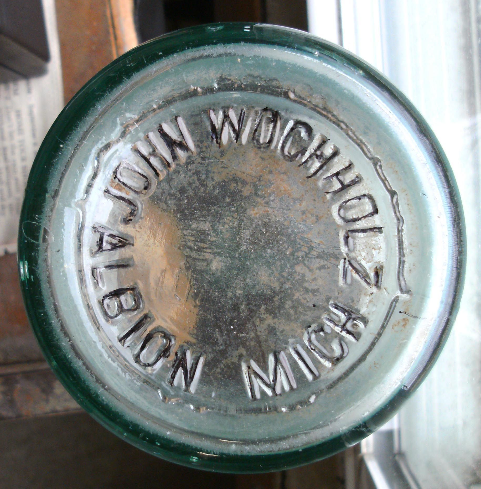 JOHN WOCHHOLZ BEVERAGE BOTTLE AND TOKEN